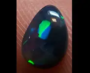 HARLEQUIN CRYSTAL BLACK OPAL 0.60 CT